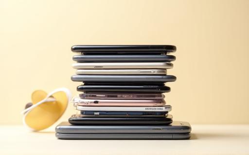 Stack of mobile phones with trade-in labels